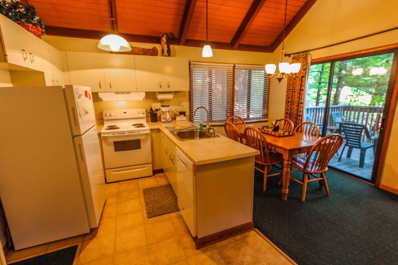 A fully equipped kitchen at VRI's Golf Club Villas in Marble Hill, Georgia.